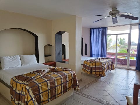 Room, 2 Double Beds | Beach/ocean view