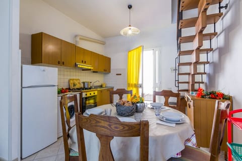 Kitchen in livingroom and stairs to the bedroom