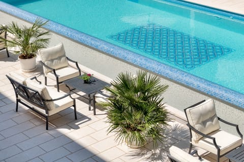 Indoor pool, outdoor pool, open 8:00 AM to 8:00 PM, pool umbrellas