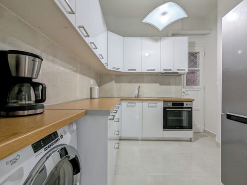 Apartment, 3 Bedrooms | Private kitchen | Full-size fridge, oven, stovetop, coffee/tea maker
