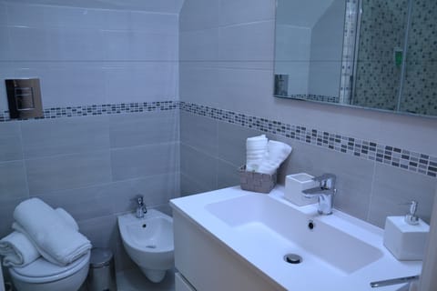 Standard Double Room | Bathroom | Shower, free toiletries, hair dryer, slippers