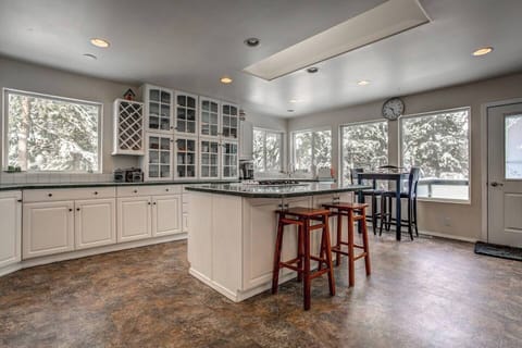 4. Fully stocked kitchen with island, and breakfast table.