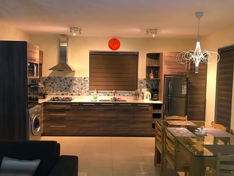 Luxury Apartment, Multiple Beds, Pool View | Private kitchen | Fridge, microwave, oven, stovetop