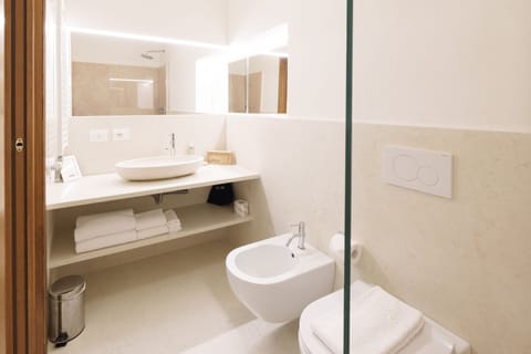 Shower, rainfall showerhead, hair dryer, towels