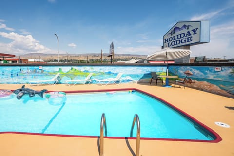 Seasonal outdoor pool, open 7:30 AM to 11:30 PM, pool umbrellas