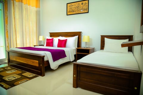 Deluxe Triple Room, Private Bathroom, Pool View | In-room safe, desk, soundproofing, iron/ironing board