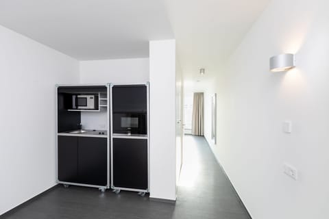 Junior Suite Rooftop | Private kitchen | Fridge, stovetop, coffee/tea maker, electric kettle