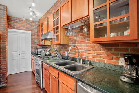 Kitchen Area. Cherry Cabinets, Soap Stone Counter Tops & Gas Range