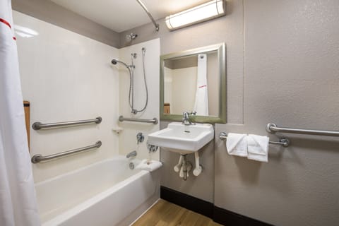 Deluxe Room, 1 King Bed, Accessible (Smoke Free) | Bathroom | Combined shower/tub, free toiletries, towels, soap