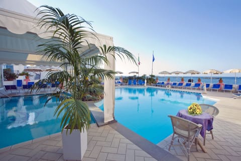 2 indoor pools, 2 outdoor pools, open 9 AM to 7 PM, pool umbrellas