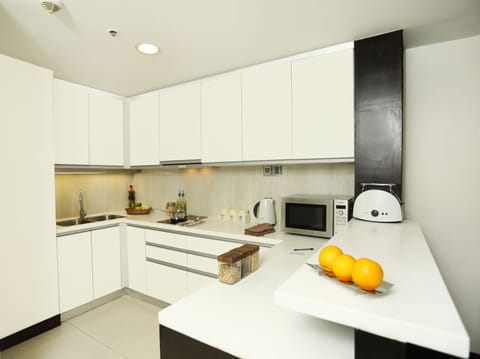 Executive Apartment, 1 Bedroom | Private kitchen | Full-size fridge, microwave, stovetop, coffee/tea maker