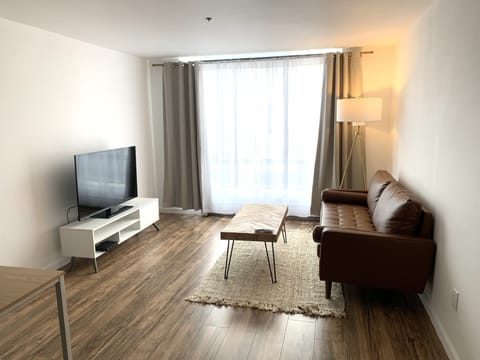1 King Bed Suite - 3rd Floor | Living area | Flat-screen TV, streaming services