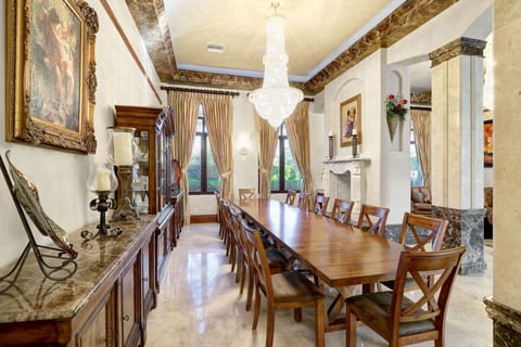 Formal dining room seating 14 people w/ fireplace off the formal seating area