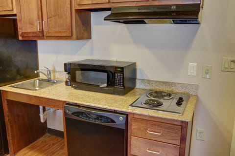 Suite, 1 Bedroom | Private kitchenette | Full-size fridge, microwave, stovetop, dishwasher