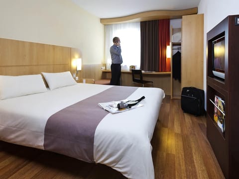 Desk, blackout drapes, soundproofing, iron/ironing board