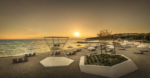 On the beach, sun loungers, beach umbrellas, beach towels