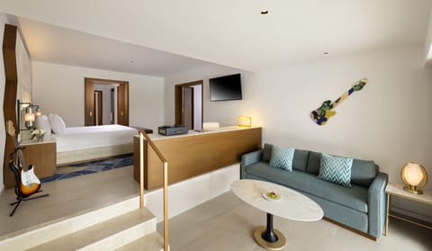 Rock Suite (One Bedroom) King Bed & Two Sofa Beds with Personal Assistant | Minibar, in-room safe, individually decorated, desk