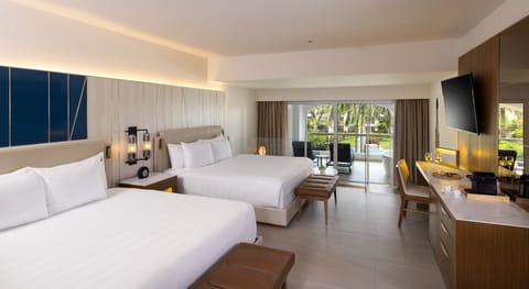 Junior Suite (Islander, Two King beds & Sofa Bed) | Minibar, in-room safe, individually decorated, desk
