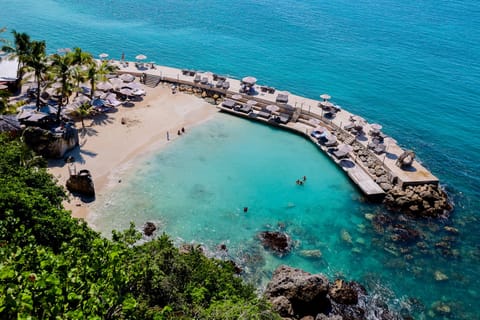 Private beach, white sand, sun loungers, beach umbrellas