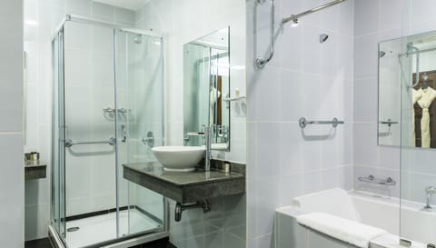 Separate tub and shower, designer toiletries, hair dryer, slippers
