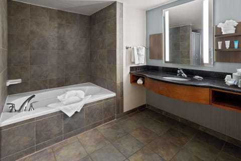 Premium Suite, 1 King Bed | Bathroom | Combined shower/tub, designer toiletries, hair dryer, towels