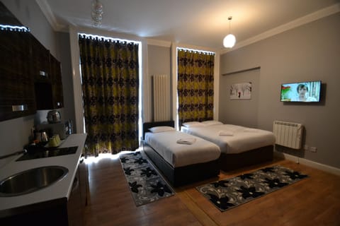 Standard Studio (1 Double and 1 Single Bed) | In-room safe, iron/ironing board, free WiFi, bed sheets