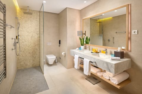 Junior Suite (Partial Sea and Marina Village View) | Bathroom | Designer toiletries, hair dryer, bathrobes, slippers