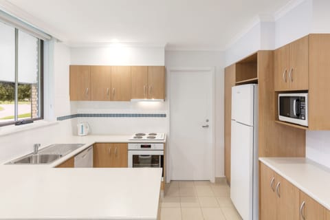 Two Bedroom Apartment | Private kitchen | Full-size fridge, microwave, stovetop, dishwasher