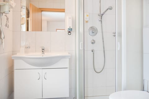 Shower, rainfall showerhead, hair dryer, towels