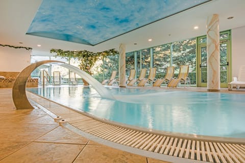 Indoor pool, open 7 AM to 7:30 PM, pool umbrellas, sun loungers