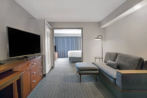 Suite, 1 Bedroom | Desk, laptop workspace, blackout drapes, iron/ironing board