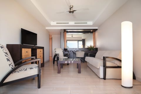 Two Bedroom Apartment with Ocean View | Living area | 26-inch flat-screen TV with satellite channels, TV