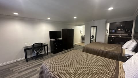 Deluxe Room, 2 Queen Beds | Minibar, desk, laptop workspace, iron/ironing board