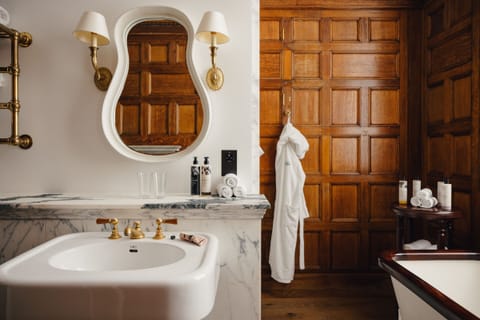 Grand Heritage Room | Bathroom | Designer toiletries, hair dryer, bathrobes, slippers