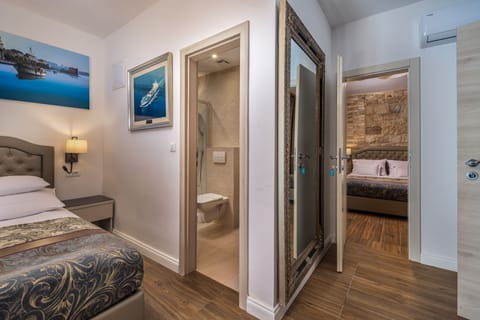 Family Room | Premium bedding, down comforters, memory foam beds, minibar