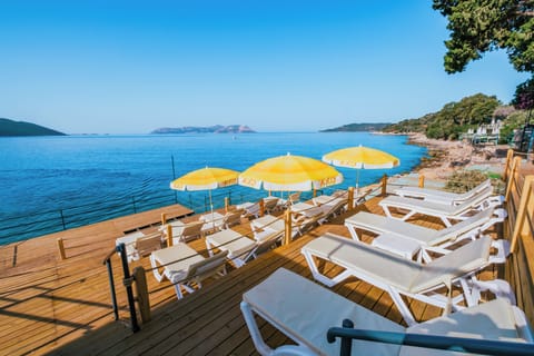 Sun loungers, beach umbrellas, beach bar