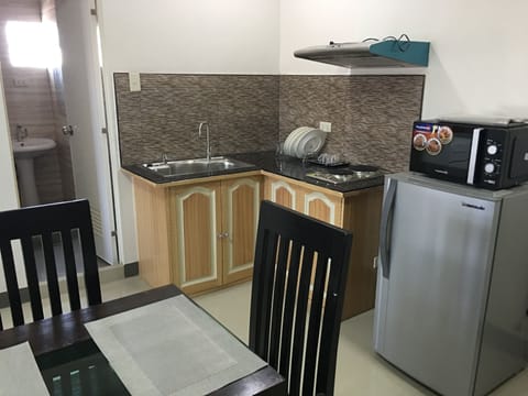 Junior Studio, Multiple Beds | Private kitchen | Microwave, stovetop, coffee/tea maker, electric kettle