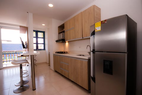 Panoramic Apartment | Private kitchen | Fridge, microwave, stovetop, cookware/dishes/utensils