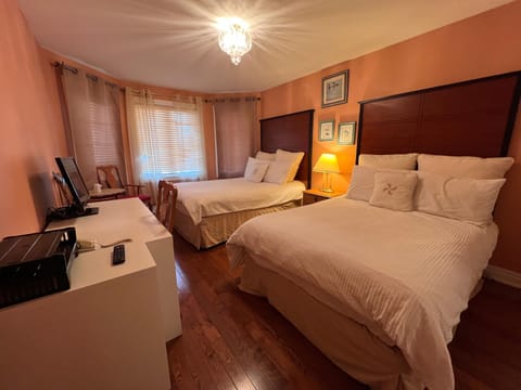 Family Room, 2 Queen Beds, Private Bathroom | Down comforters, individually decorated, individually furnished, desk