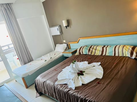 Triple room city view | Blackout drapes, iron/ironing board, free WiFi, bed sheets