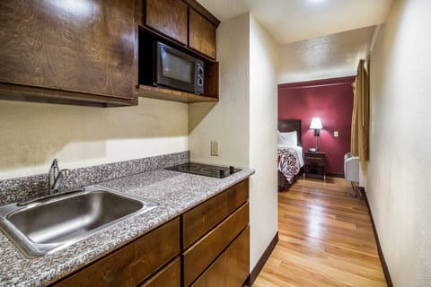 Suite, 1 King Bed, Non Smoking, Kitchenette | Private kitchenette | Fridge, microwave