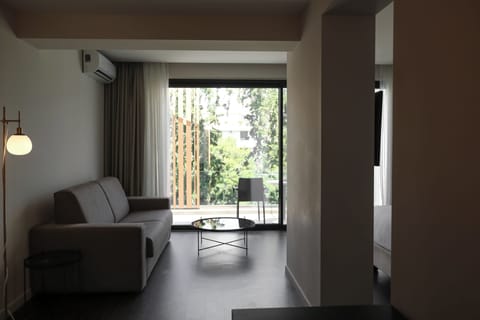 Premium Suite (Top Floor) | Living area | Flat-screen TV