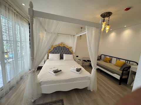 Quadruple Room, Garden View | Premium bedding, minibar, in-room safe, individually decorated