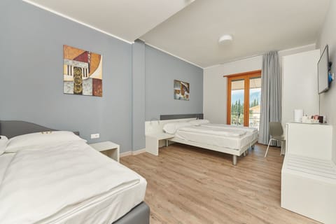 Family Quadruple Room, Balcony | Frette Italian sheets, hypo-allergenic bedding, down comforters