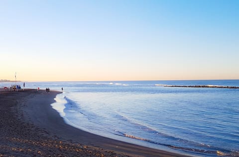 Beach nearby, black sand, beach towels