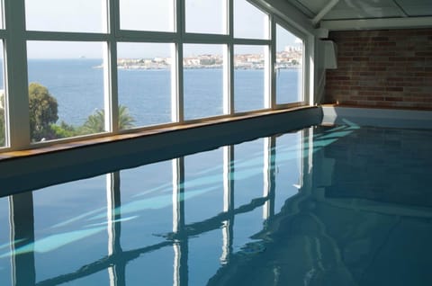 Indoor pool, open 9:30 AM to 10:00 PM, sun loungers