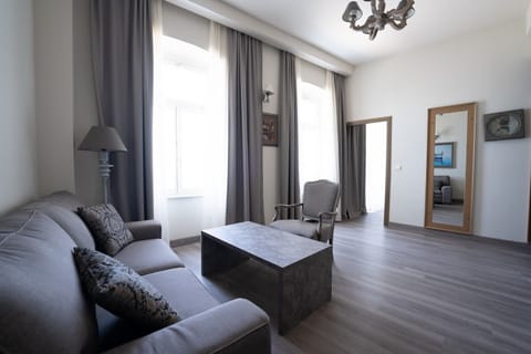 Deluxe Suite with Balcony and Sea View | 1 bedroom, minibar, in-room safe, desk
