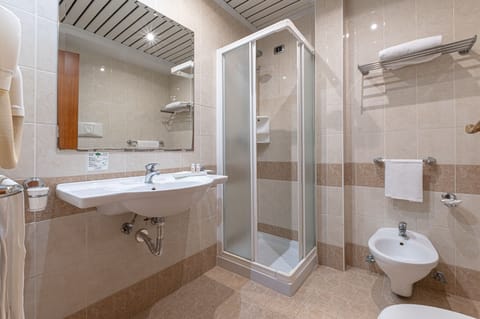 Shower, eco-friendly toiletries, hair dryer, bidet