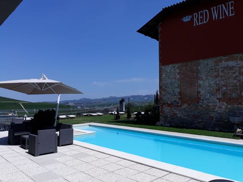 Outdoor pool, pool umbrellas, sun loungers