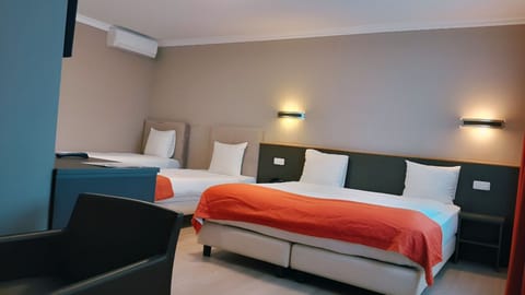 Standard Quadruple Room, Multiple Beds, Non Smoking | In-room safe, desk, laptop workspace, soundproofing